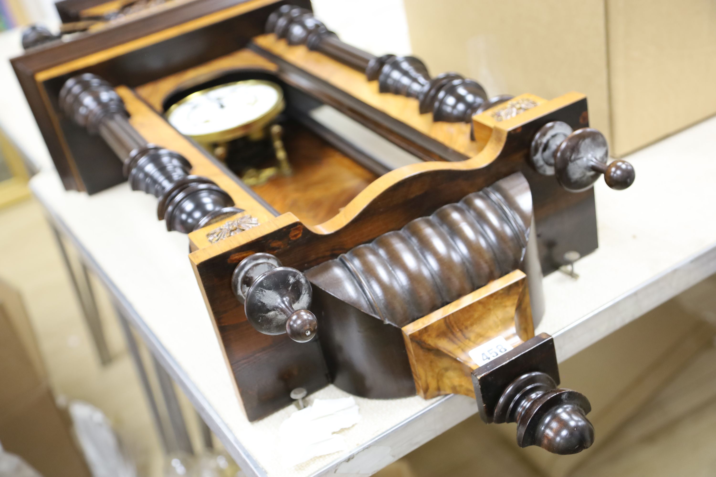 A 19th century German walnut wall clock, length 102cm